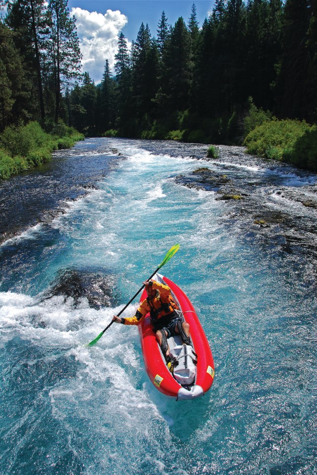 Kayaker on the Metolius River by Leon Werdinger